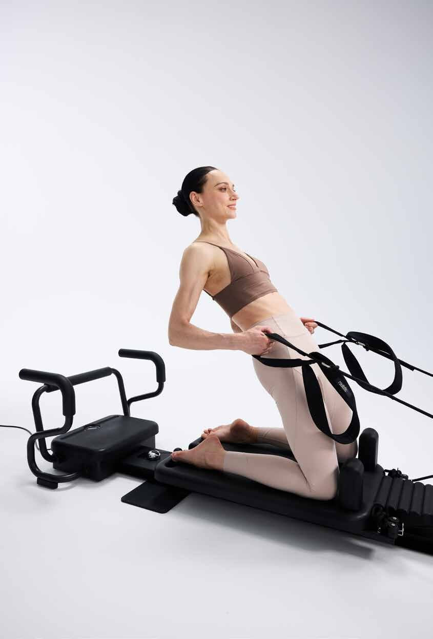 Exercice aux sangles sur le reformer RS03 PRO